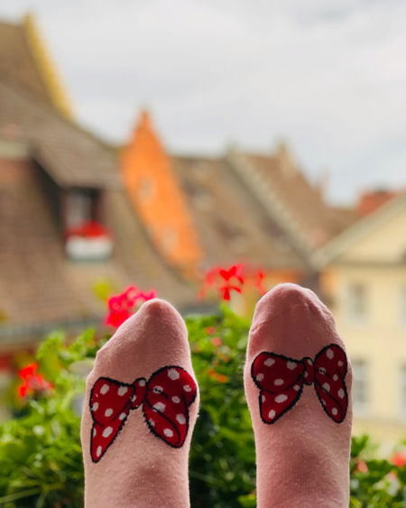 Low section of woman wearing shoes