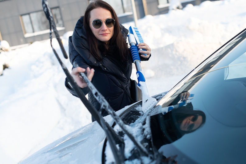 Portrait of young woman in car