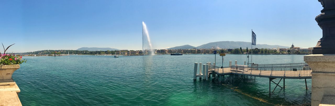 Panoramic view of sea against clear blue sky