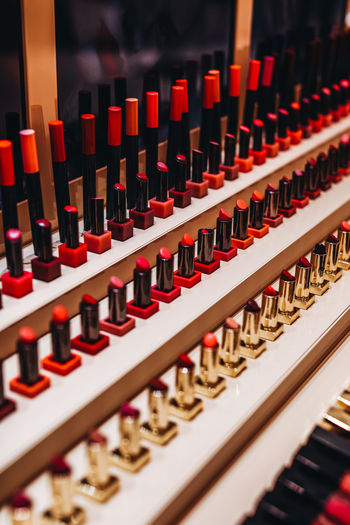 Mockup of pink red glossy lipsticks on a stand. background for branding and packaging presentation. 