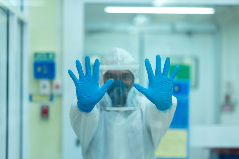 Portrait of man gesturing in laboratory