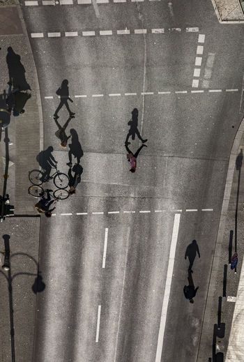 High angle view of people walking on street in city
