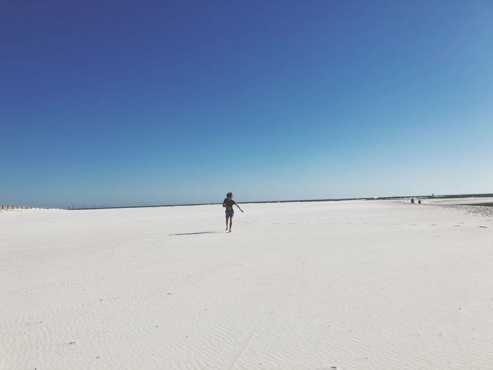 Walking alone on beach 