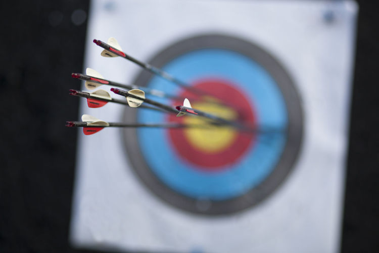 Close-up of arrow on dartboard