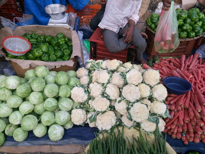 High angle view of man selling vegetables at market