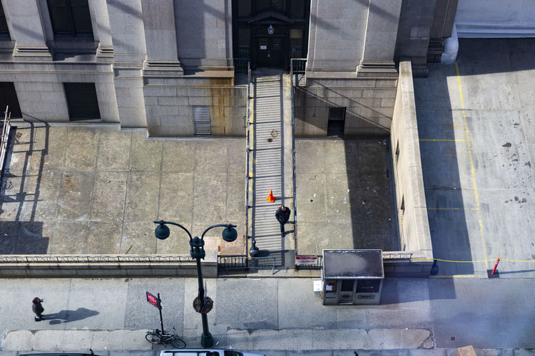 High angle view of people walking on street against buildings