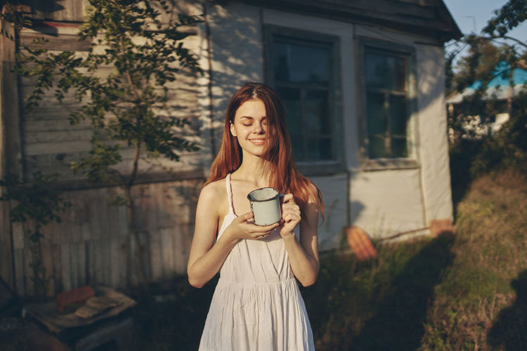 Young woman with coffee cup