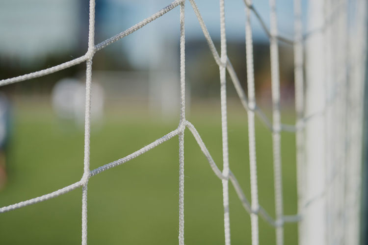 Soccer or football net background, view from behind the goal with blur