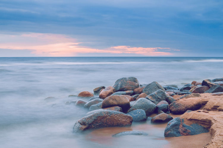 Scenic view of sea against sky at sunset