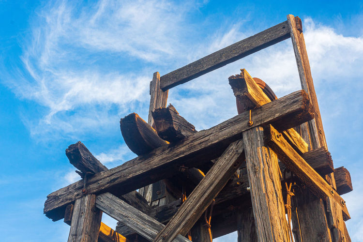 Close up of a wooden mine derrick made of large timber beams, mazarron, spain