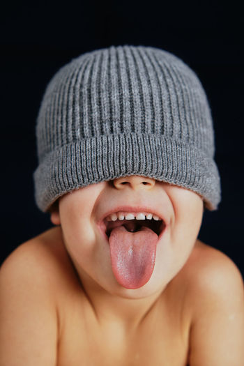 Little boy with tongue