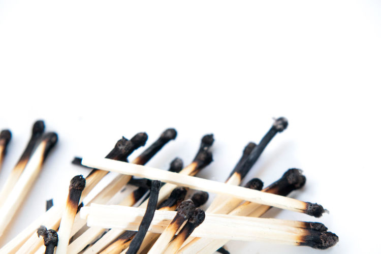 Close-up of piano against white background