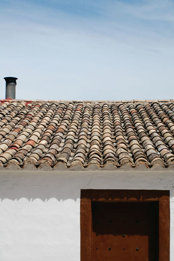 Roof tiles against sky