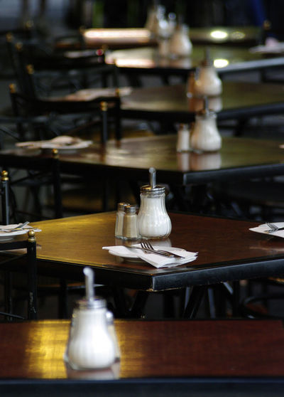 Salt and pepper shaker on table in restaurant