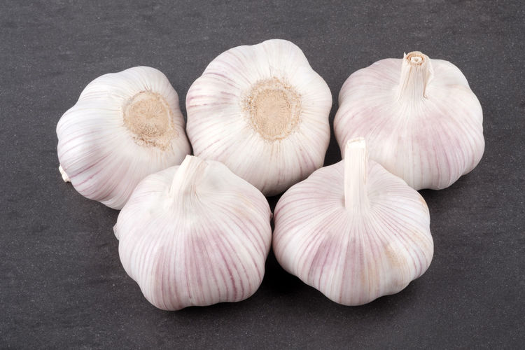 High angle view of garlic on white background