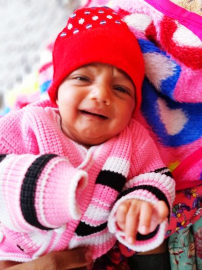 Portrait of cute baby girl in hat