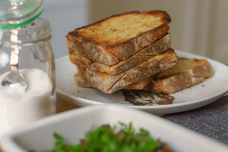 Toasted bread served in plate on table