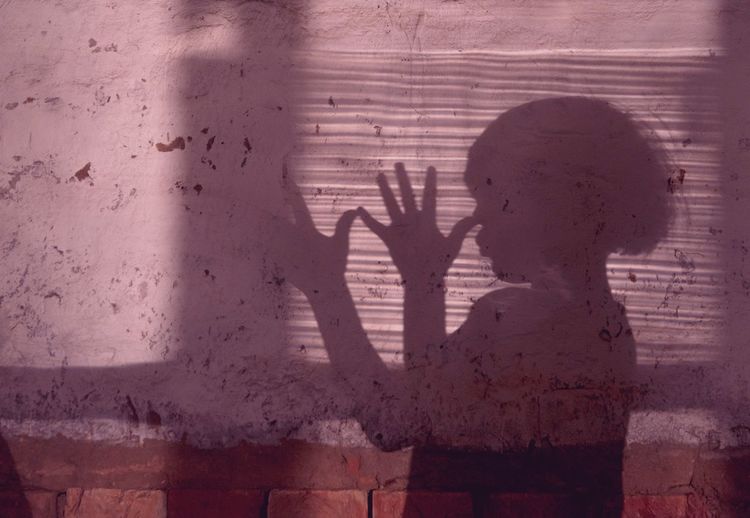 Kid profile shadow on the pink wall