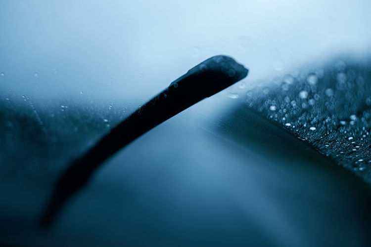 Close up of windshield wiper in rain