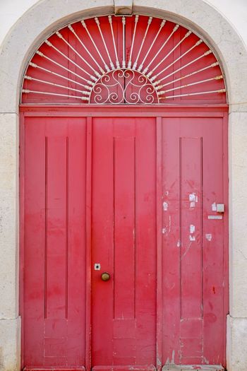 Closed red door of building