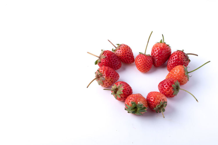 High angle view of strawberry over white background
