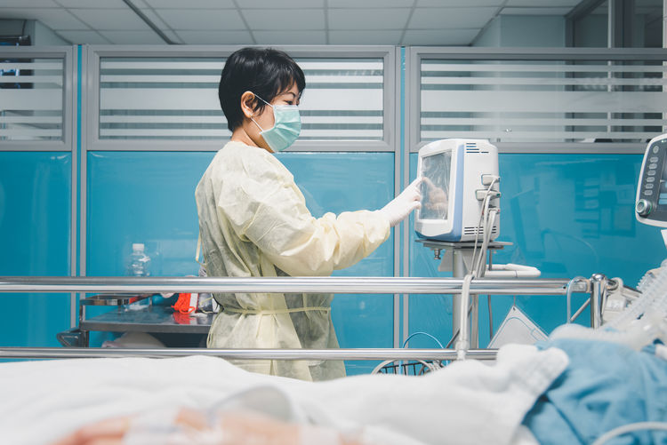 Side view of doctor working in hospital
