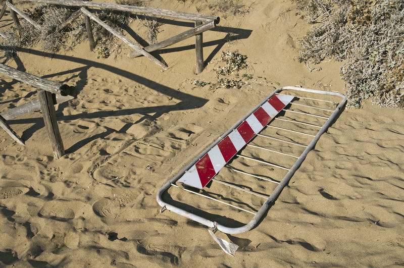 Deck chairs on sand at beach