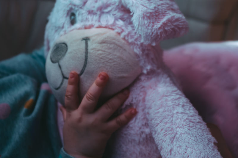 Close-up of baby sleeping on bed