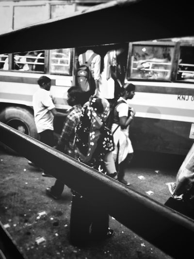 High angle view of people standing in car