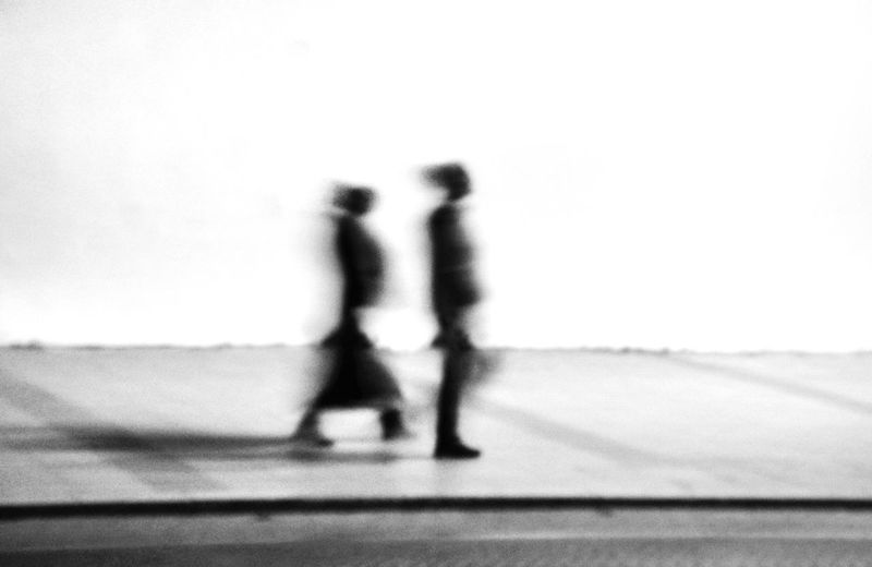 Blurred image of people walking on street