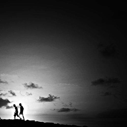 Silhouette people standing on landscape