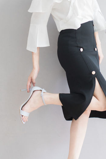 Low section of woman standing on floor