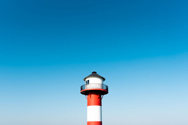 Low angle view of lighthouse against clear sky