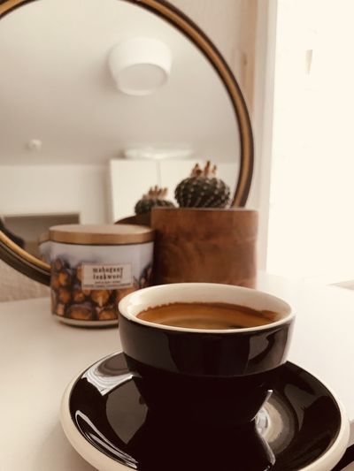Close-up of coffee cup on table