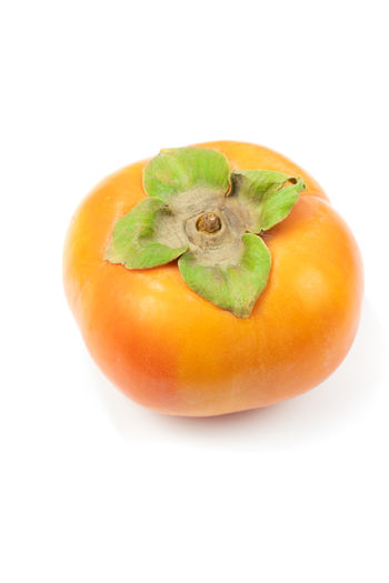 High angle view of tomato against white background