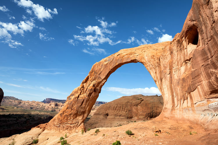Natural rock arch against blue sky