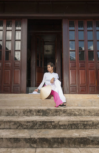 Beautiful woman exploring the imperial palace in hue / vietnam