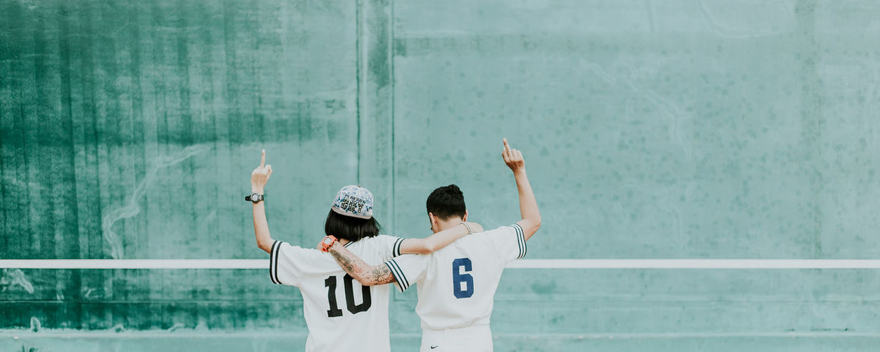 Arms Raised Clothing Day Holding Human Arm Human Limb Leisure Activity Lifestyles Limb Men Nature Outdoors People Photography Themes Real People Rear View Standing Two People Waist Up Wall - Building Feature Women