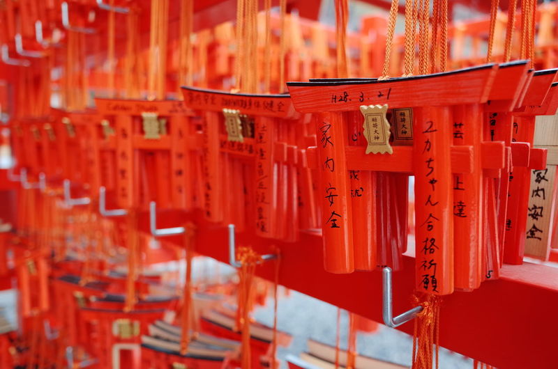 Orange torii gates for sale in market