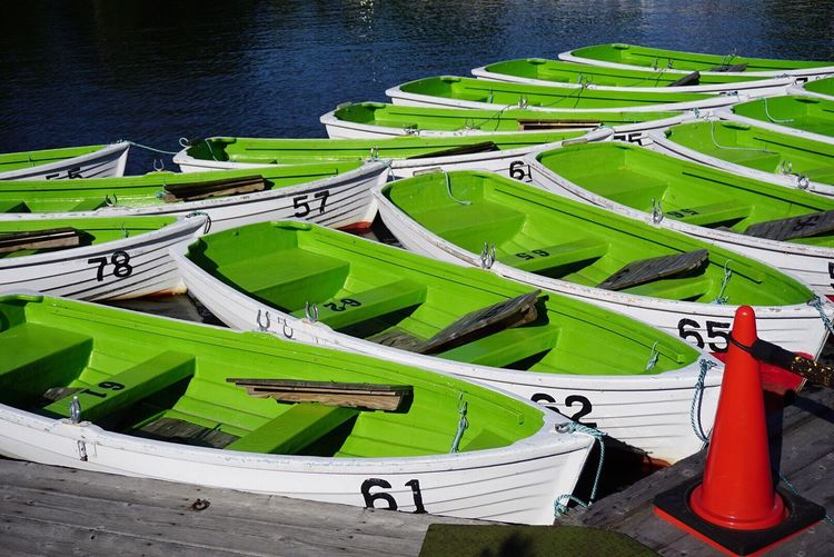 Green boats on lake during sunny lake