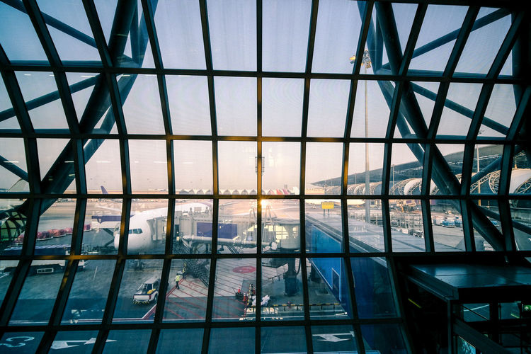 Modern buildings seen through glass window at the airport