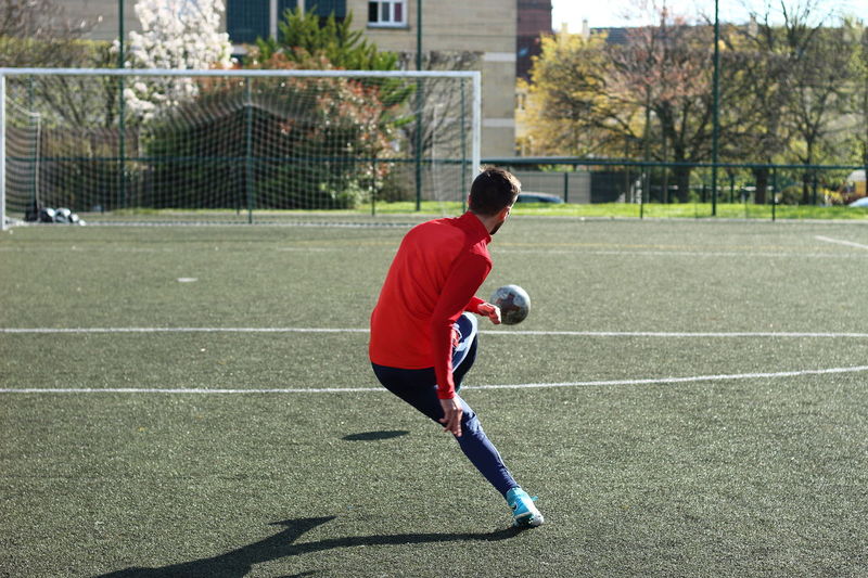 Professional Soccer Player Blue White Uniform Ball Football Pitch Stadium  Stock Photo by ©VitalikRadko 371872680