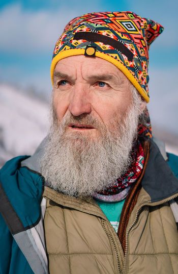 Portrait of bearded mature man wearing warm clothing during winter