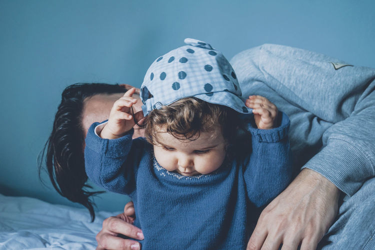 Father playing with daughter at home