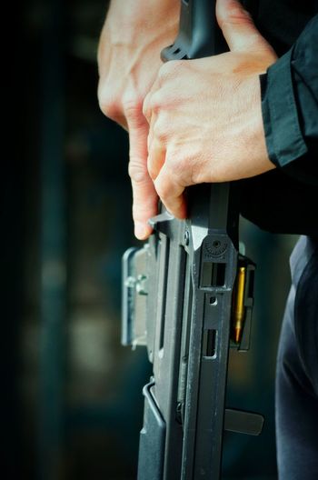 Close-up of man holding gun