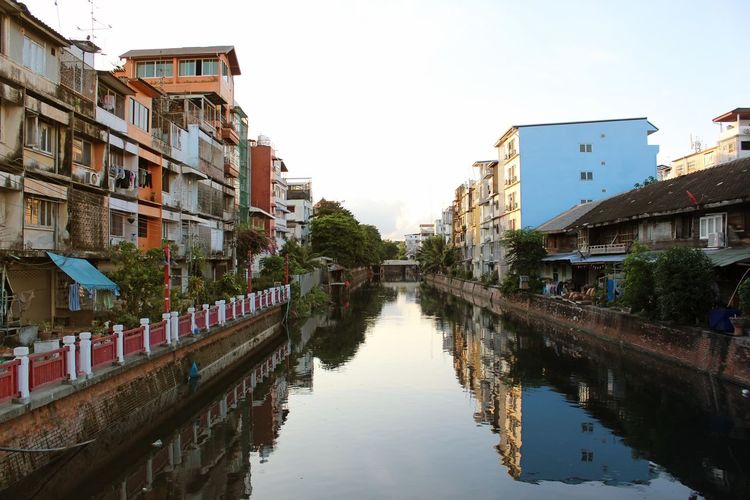 Canal amidst houses in a city