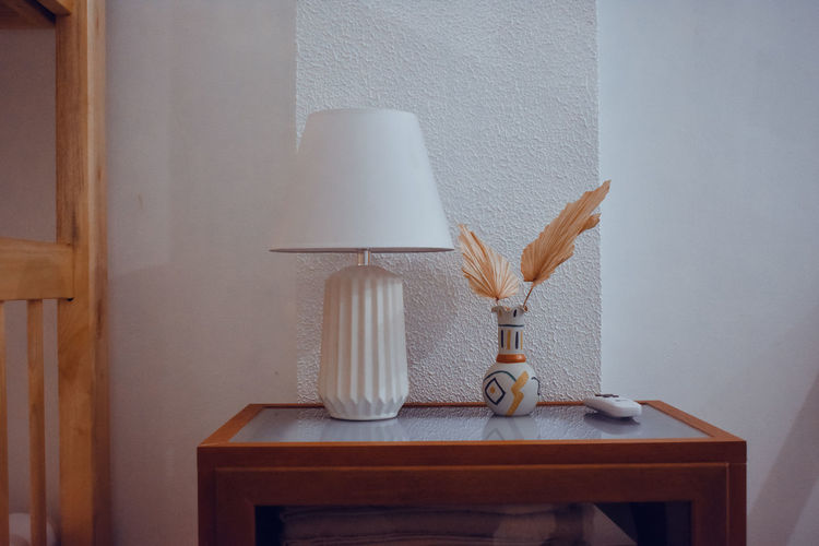 Close-up of lamp on table