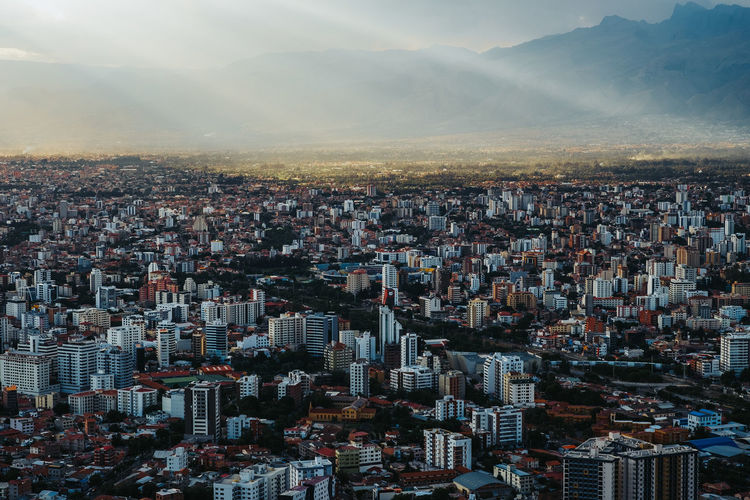 Areal view of the city of cochabamba, bolivia with some rays of sunlight. located in south america