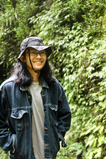 Portrait of young man standing outdoors