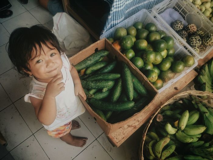 Child in food market